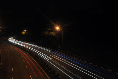 High angle view of light trails on road