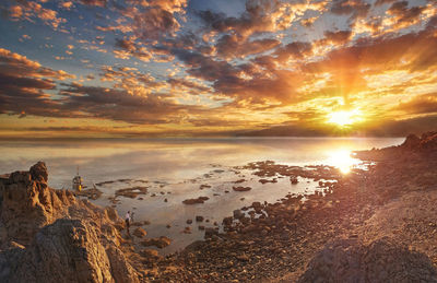 Scenic view of calm sea at sunset