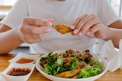 Boy eating fried chicken