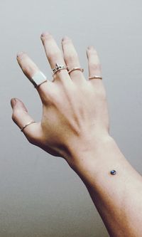 Close-up of woman hand against white background