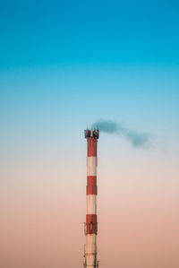 Smoke stack against clear sky