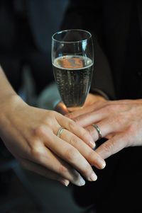 Cropped image of hand holding cigarette