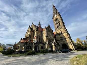Low angle view of buildings against sky in city