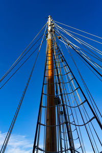 Low angle view of bridge against blue sky