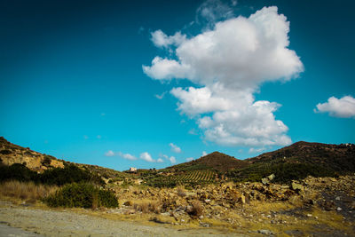 Scenic view of landscape against cloudy sky