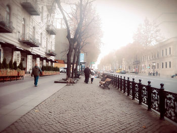 People walking on street in city