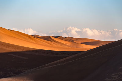 View from nature and landscapes of dasht e lut or sahara desert after the rain with wet sand dunes