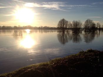 Scenic view of lake at sunset