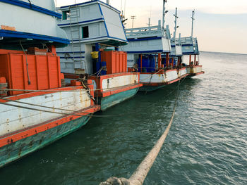 Boats moored in sea