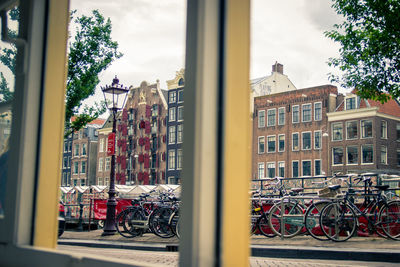 Bicycle against building in city