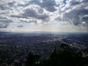 Aerial view of cityscape against sky