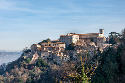 Buildings in city against sky