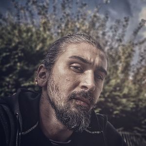 Close-up portrait of serious bearded man