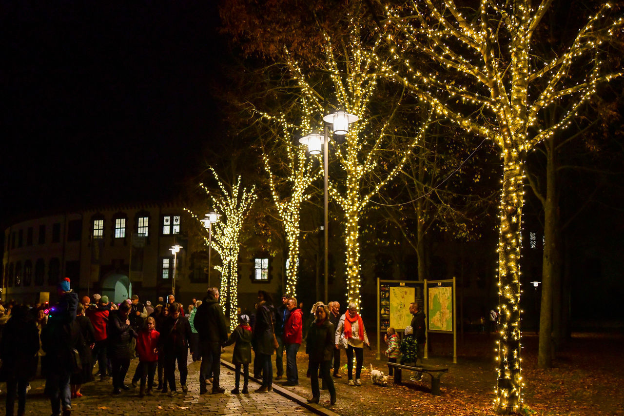 CROWD AT ILLUMINATED CHRISTMAS TREE