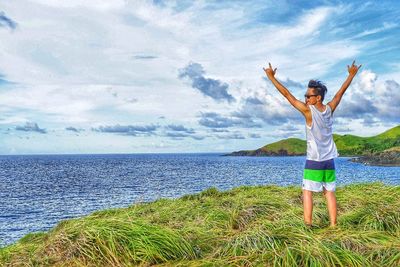 Full length of man standing by sea against sky