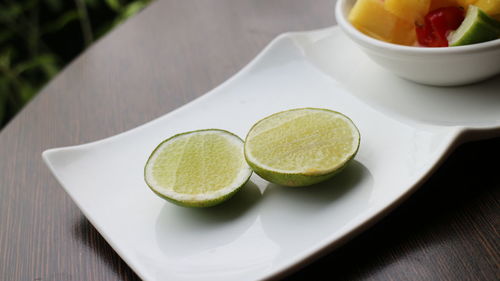 High angle view of fruits in plate on table