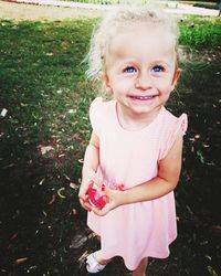 Portrait of smiling girl on field