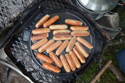 High angle view of sausages on barbecue grill