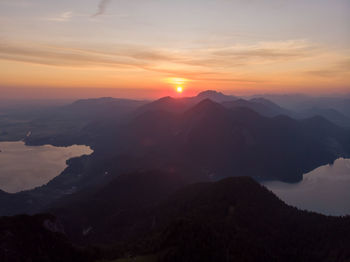 Scenic view of silhouette mountains against sky during sunset