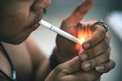 Close-up of man holding hands