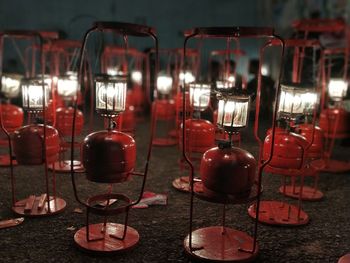 Close-up of electric lamps at night