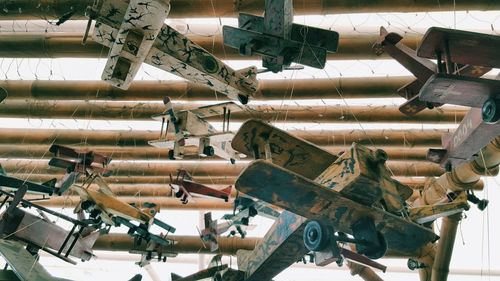 Low angle view of artificial airplanes hanging on ceiling