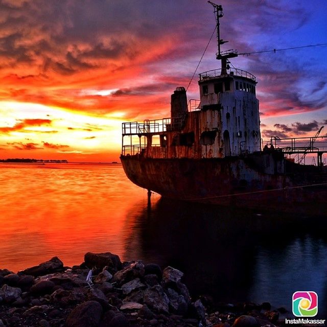 sunset, water, sky, architecture, built structure, building exterior, sea, orange color, lighthouse, cloud - sky, transportation, guidance, nautical vessel, scenics, cloud, beauty in nature, reflection, nature, dramatic sky, dusk