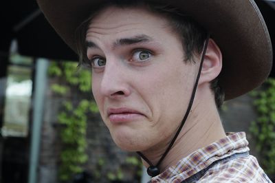 Close-up portrait of man wearing hat