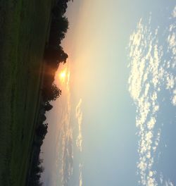 Scenic view of field against sky during sunset