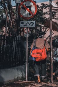 Rear view of man walking on street