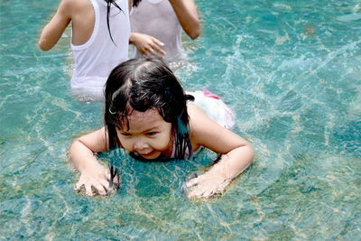 Mother and daughter in swimming pool