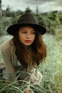 Portrait of young woman in field