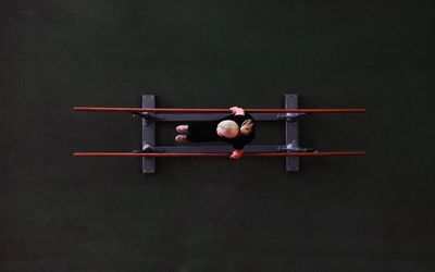 High angle view of woman training in gym