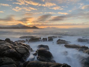 Scenic view of sea against sky during sunset