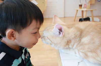 Cute boy with cat