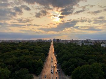 Panoramic view of city buildings against cloudy sky