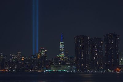 Illuminated buildings in city at night