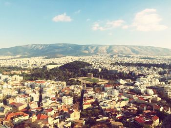 Aerial view of cityscape against sky