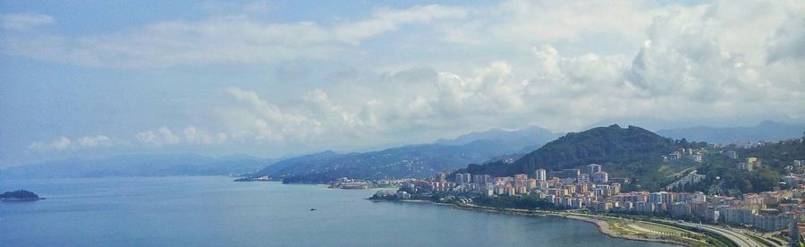 City skyline with sea in background