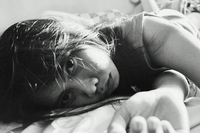 Close-up of baby sleeping on bed at home