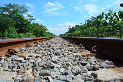 Surface level of railroad track against sky