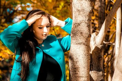 Young woman looking away outdoors