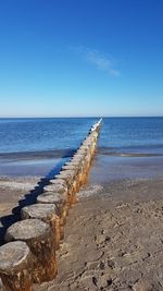 Scenic view of sea against clear blue sky