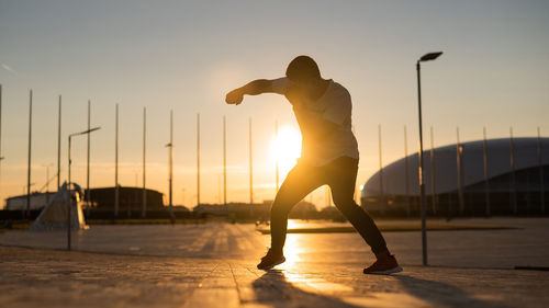 Low angle view of man walking on street