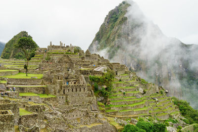 Rocky mountains at machu picchu during foggy weather