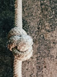 Close-up of rope tied on wall