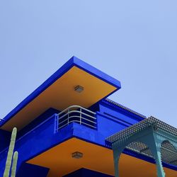 Low angle view of illuminated building against clear sky