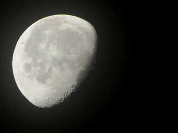 Low angle view of moon against clear sky at night