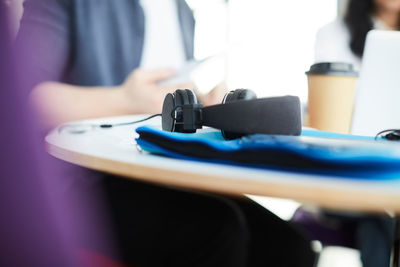 Close-up of headphones on table in cafeteria