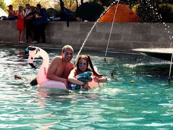 People enjoying in swimming pool